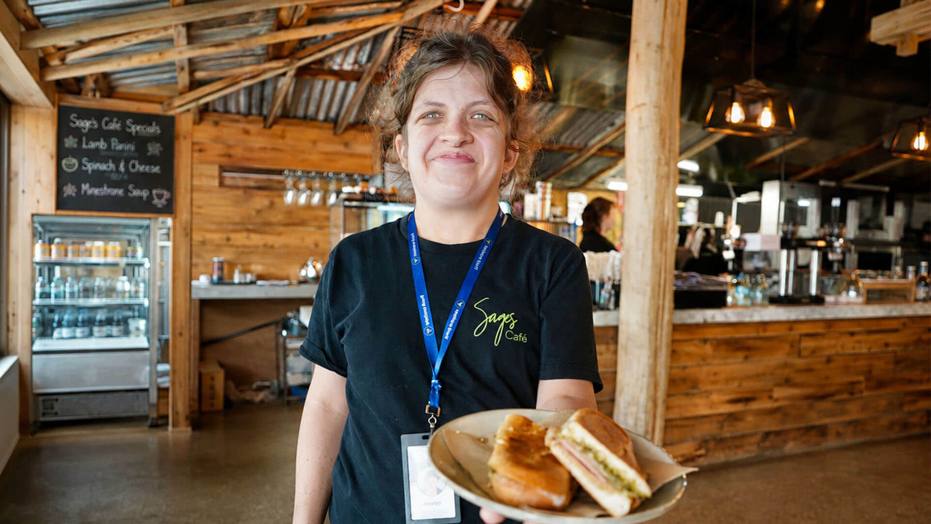 Sages Cafe client with sandwich
